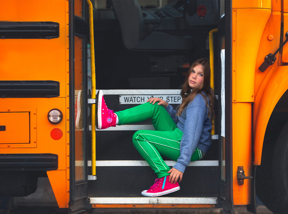 girl sitting on in the doorway of a bus Photoshop editing tutorial