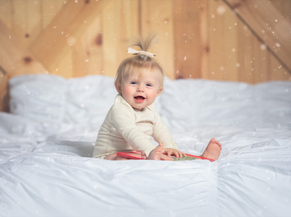 toddler on bed with snow Photoshop editing tutorial